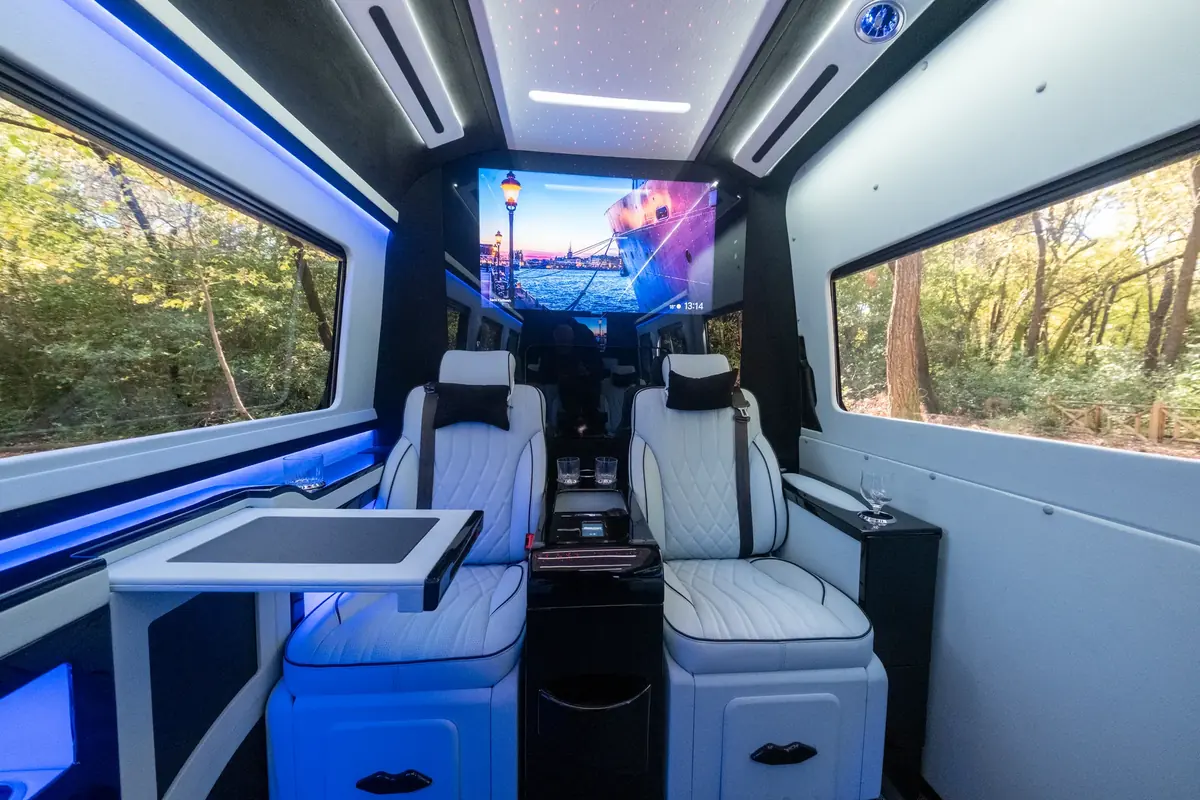 Ultra Lux Sprinter interior with TV and ambient lighting